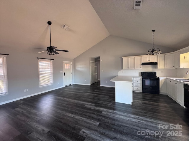 kitchen with dark hardwood / wood-style floors, ceiling fan with notable chandelier, white cabinets, black electric range, and sink