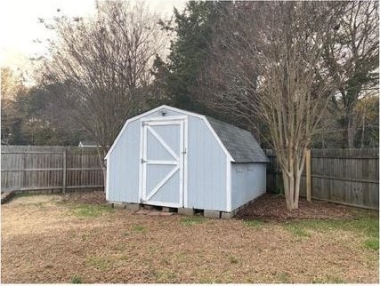 view of outbuilding featuring a yard