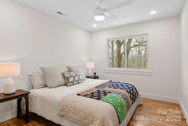 bedroom featuring ceiling fan and hardwood / wood-style floors