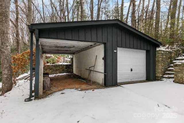 view of snow covered garage