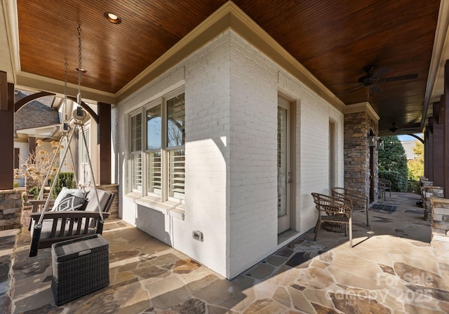 view of patio / terrace featuring ceiling fan