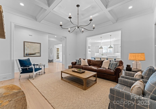 living room with coffered ceiling, light hardwood / wood-style flooring, and beam ceiling