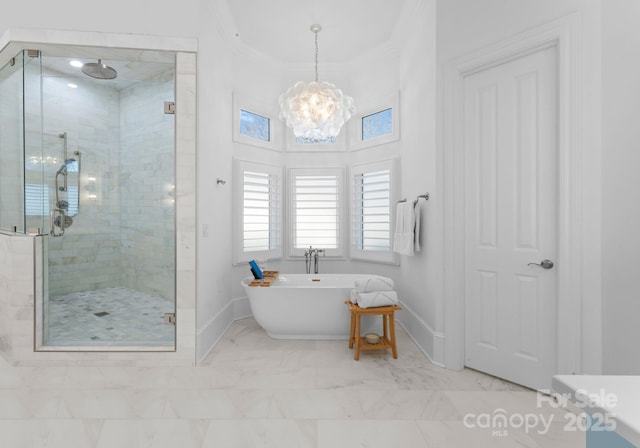 bathroom featuring an inviting chandelier, shower with separate bathtub, and crown molding