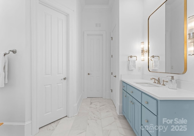 bathroom with crown molding and vanity