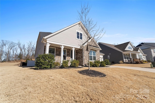 front of property featuring a front lawn and a porch