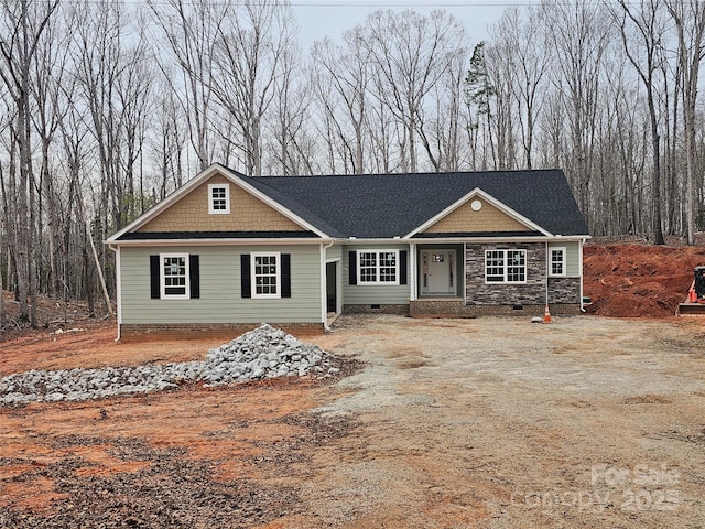 view of front of home featuring crawl space and stone siding