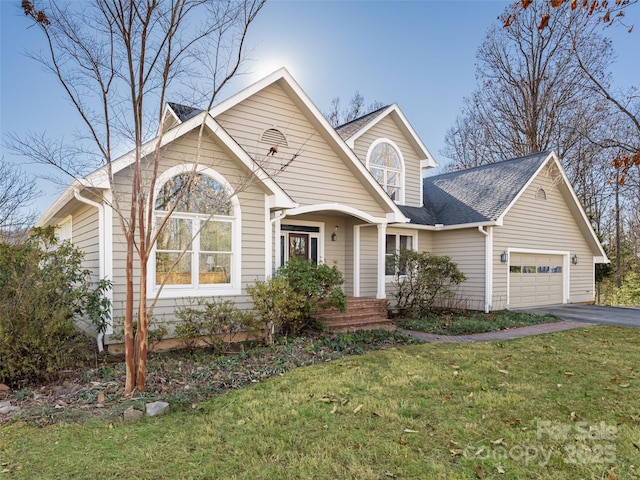 view of front facade featuring a garage and a front lawn