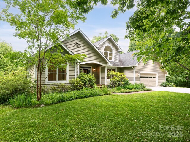 15 Breckenridge Dr, Fairview, NC 28730 - traditional home with an attached garage, a front yard, driveway, and a shingled roof