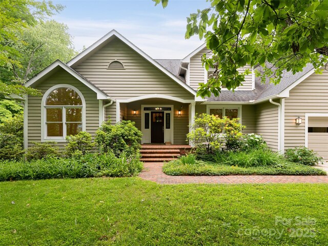 15 Breckenridge Dr, Fairview, NC 28730 - traditional home with a front lawn, roof with shingles, and a garage