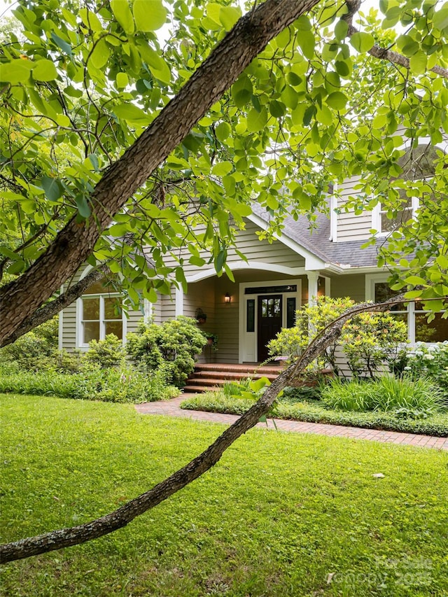 15 Breckenridge Dr, Fairview, NC 28730 - view of front of house featuring a front lawn and a shingled roof