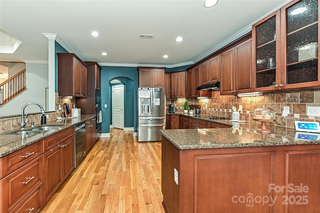 kitchen featuring stone countertops, kitchen peninsula, sink, and black appliances