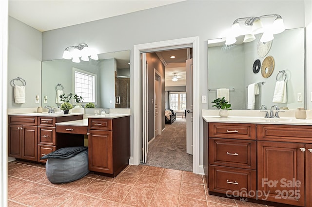 bathroom with ceiling fan, tile patterned floors, and vanity