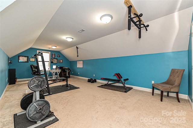 exercise room featuring light carpet and lofted ceiling