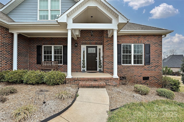 doorway to property with a porch