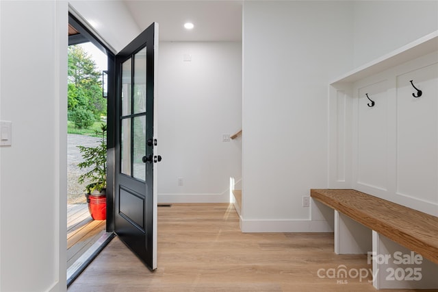 mudroom with light hardwood / wood-style flooring