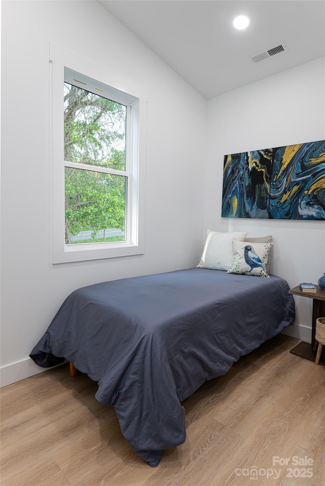 bedroom featuring light wood-type flooring