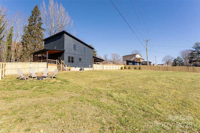 view of yard with an outdoor fire pit