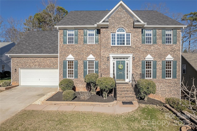 colonial house featuring a garage