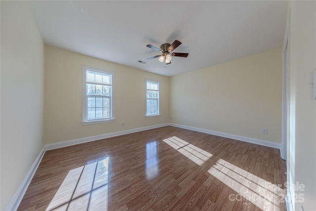 spare room featuring ceiling fan and light hardwood / wood-style flooring