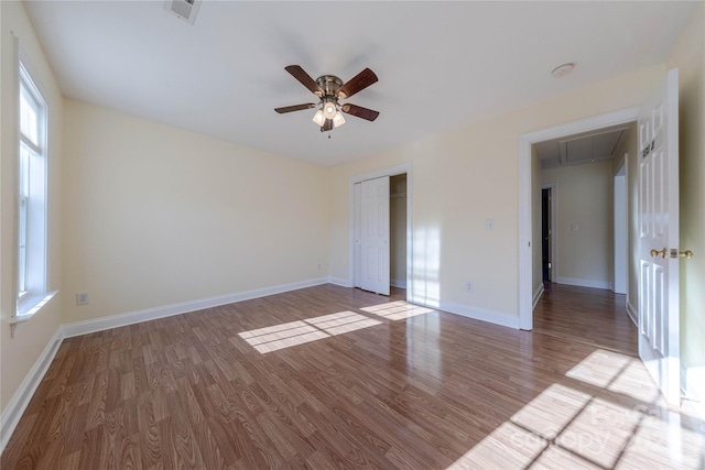 spare room featuring ceiling fan and hardwood / wood-style flooring