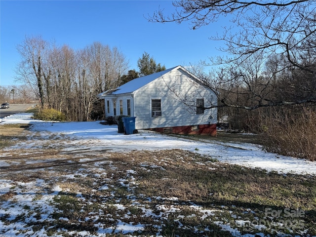 view of snow covered property