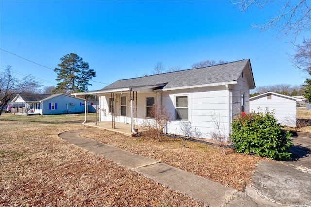 view of front of home with a front yard and a porch