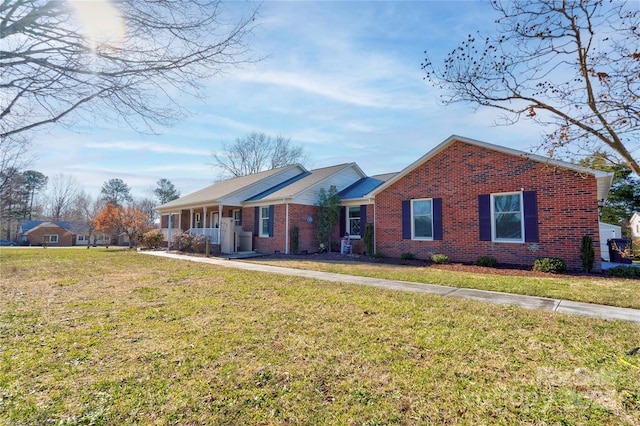 ranch-style home with a front lawn