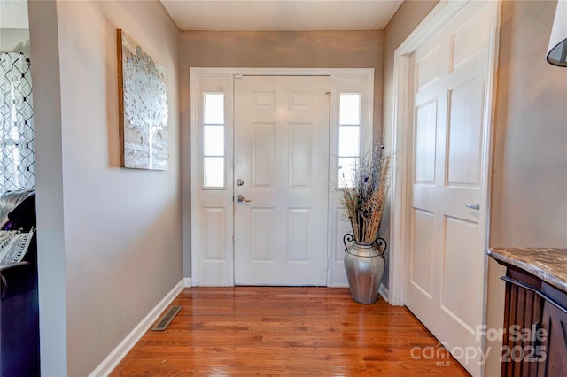 foyer featuring light wood-type flooring