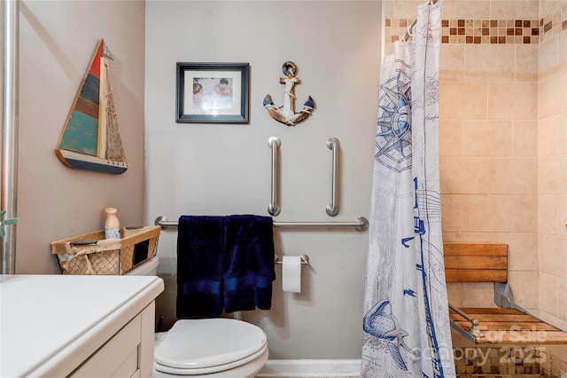 bathroom featuring a shower with curtain, vanity, and toilet