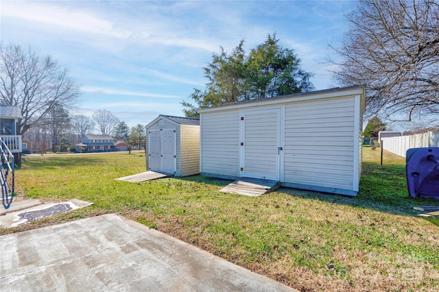 view of outdoor structure featuring a lawn