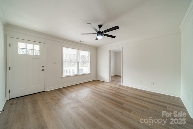 entrance foyer featuring crown molding, ceiling fan, and light wood-type flooring