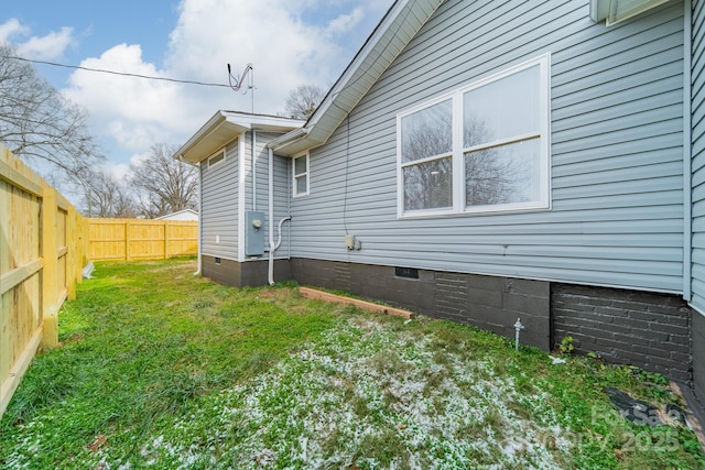 view of property exterior featuring a lawn