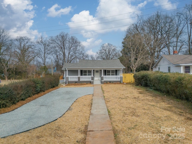 view of front of home with a front lawn and a porch