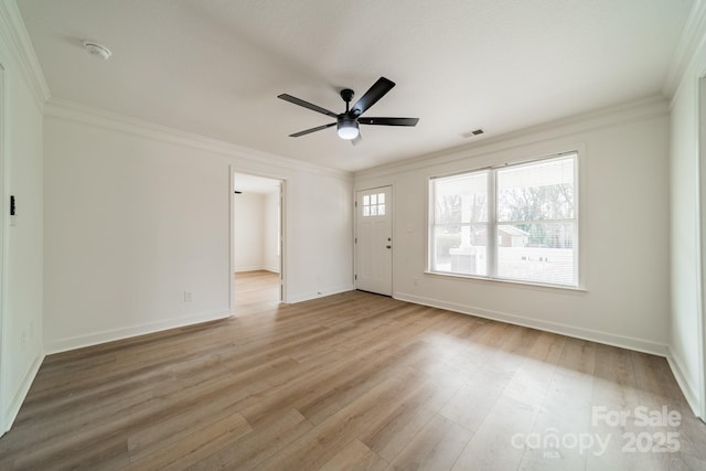 interior space with ornamental molding, ceiling fan, and light hardwood / wood-style flooring