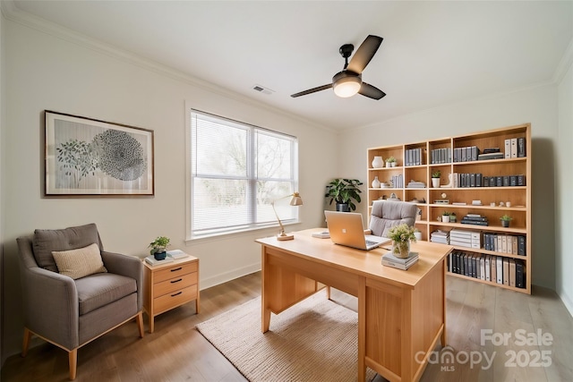 office area with hardwood / wood-style flooring, ornamental molding, and ceiling fan