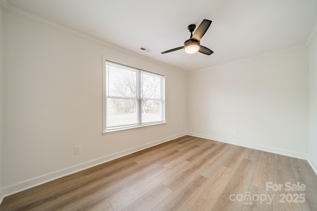 empty room featuring ornamental molding, ceiling fan, and light hardwood / wood-style floors