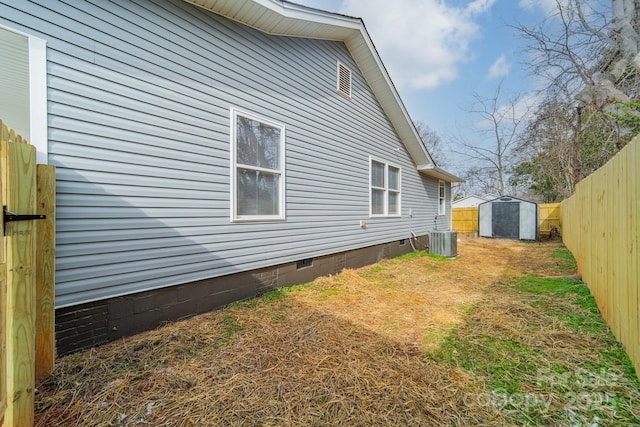 view of property exterior with a storage unit and central AC unit