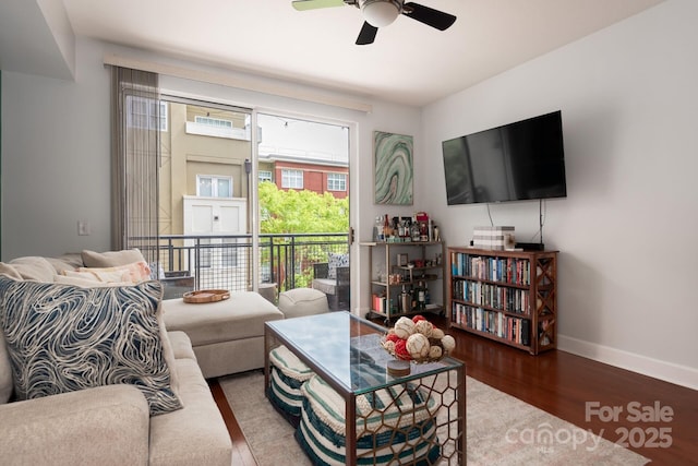 living room with ceiling fan and hardwood / wood-style flooring