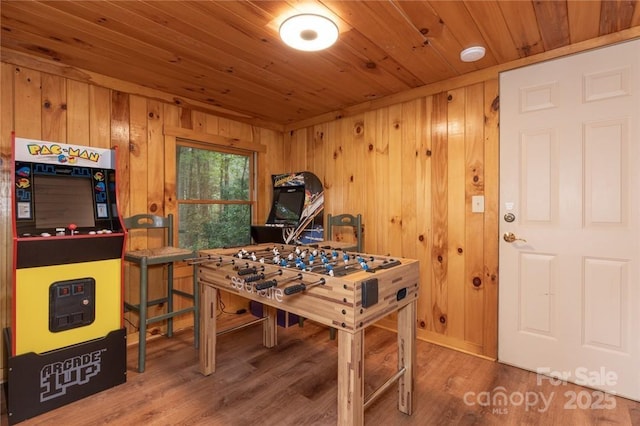 playroom featuring wood ceiling, wood walls, and wood finished floors