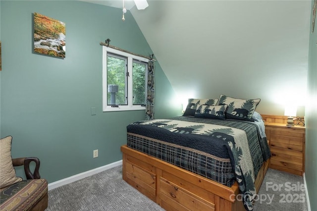 carpeted bedroom featuring vaulted ceiling, baseboards, and ceiling fan