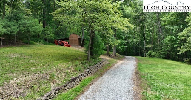 view of street with a forest view