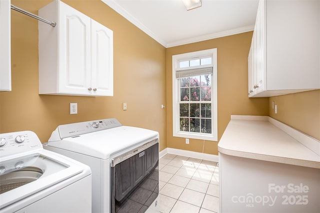 laundry area with ornamental molding, cabinets, separate washer and dryer, and light tile patterned floors