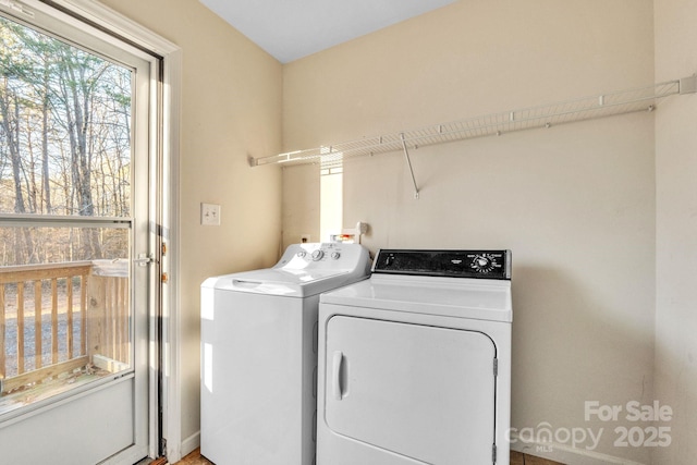 laundry area featuring washing machine and clothes dryer