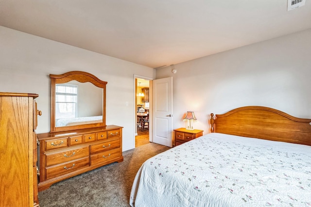 bedroom with dark carpet