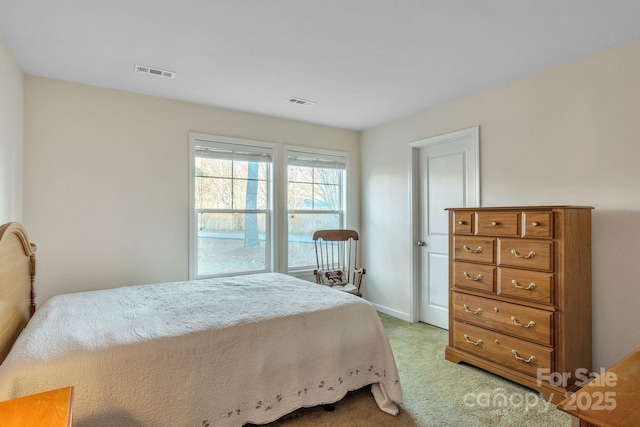 bedroom featuring light colored carpet