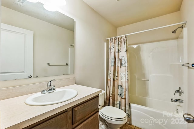 full bathroom with toilet, shower / tub combo with curtain, and vanity