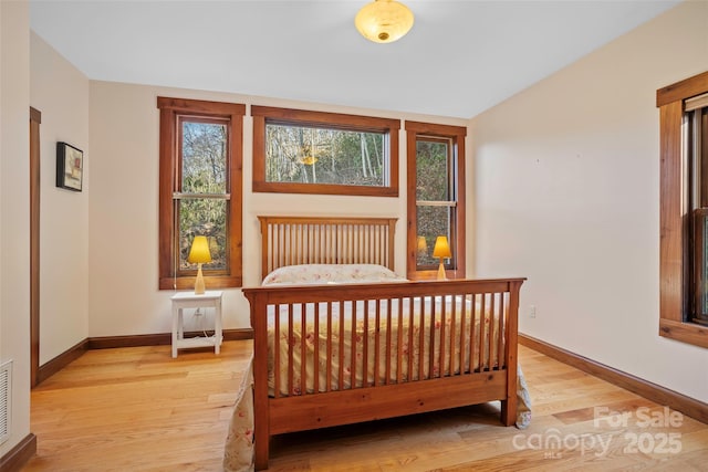 bedroom with light wood-type flooring