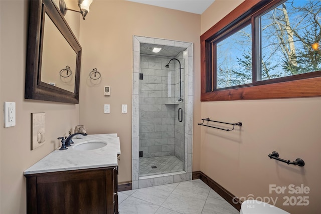 bathroom with vanity and a shower with shower door