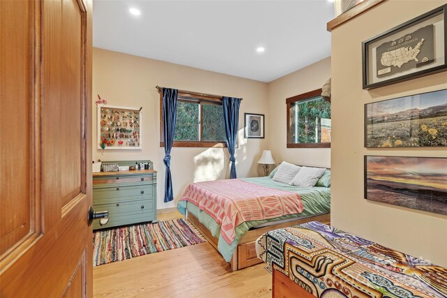 bedroom with light hardwood / wood-style floors