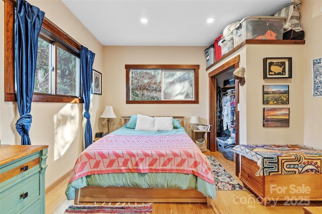 bedroom with light hardwood / wood-style flooring